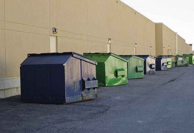 conveniently located dumpsters for construction workers use in Harrington